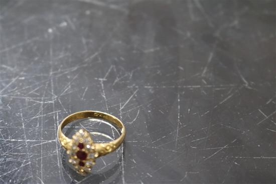 An early-mid 20th century 18ct gold, ruby and diamond marquise cluster ring, size M.